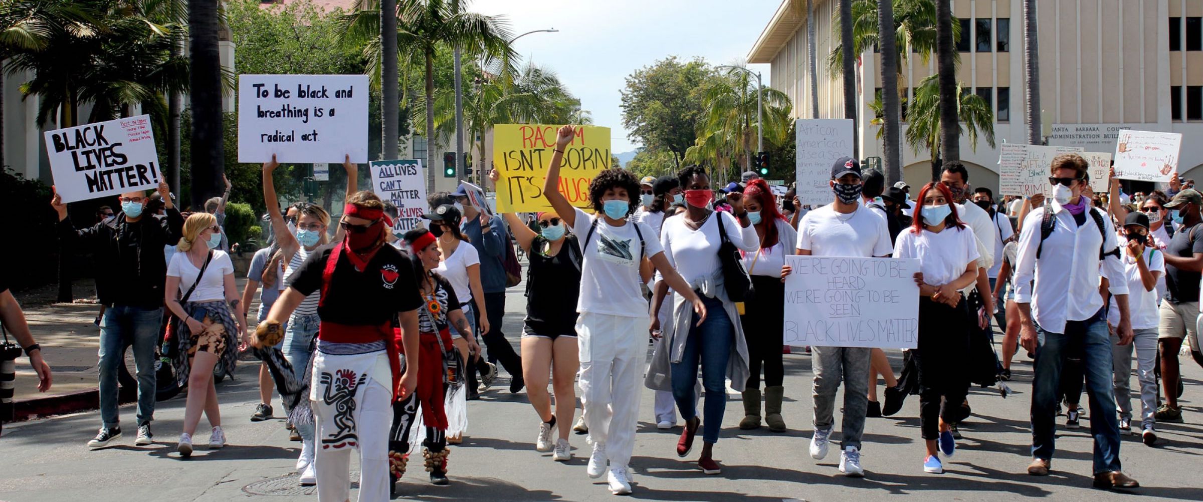 Photo of people at a protest in downtown Santa Barbara wearing facial coverings due to COVID-19