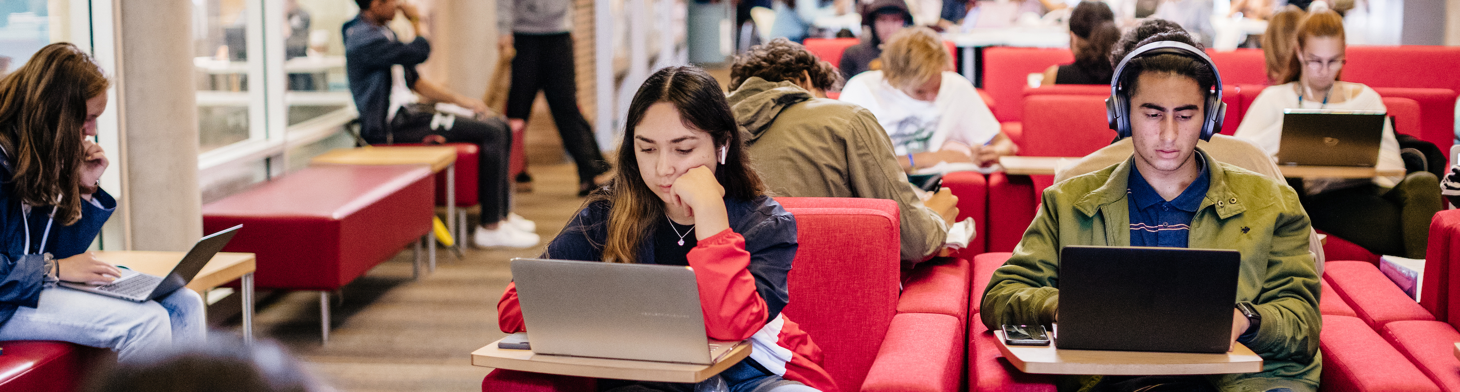 Students studying on computers in the SRB atrium