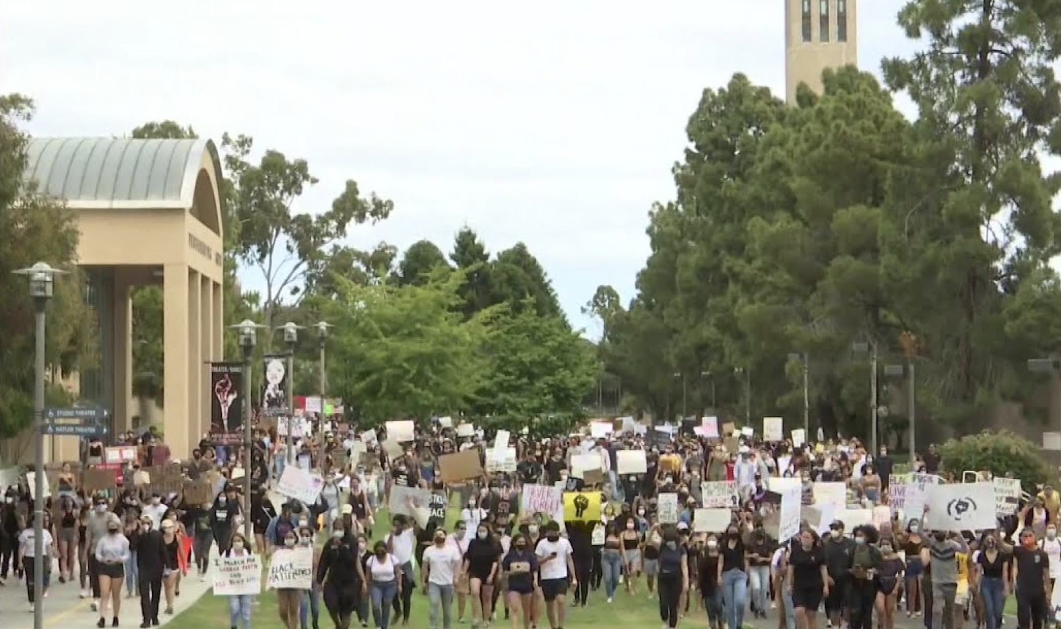 Picture of protesters wearing face coverings for COVID-19